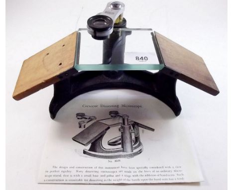 An R &amp; J Beck dissecting microscope with military arrow mark and instructions
