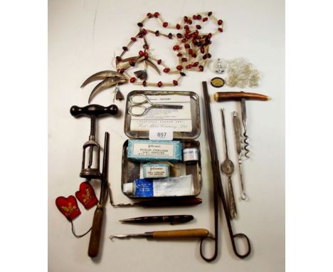 A box of collectables including vintage glass buttons, a sprung corkscrew and a horn handled corkscrew, vintage curling tongs