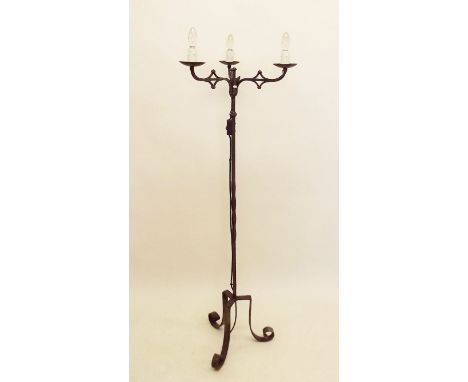 A wrought iron stand lamp