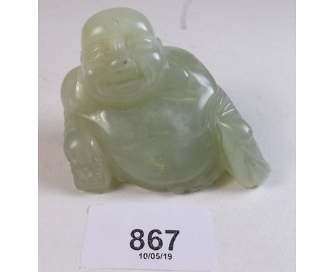 A carved jade Buddha 7cm wide
