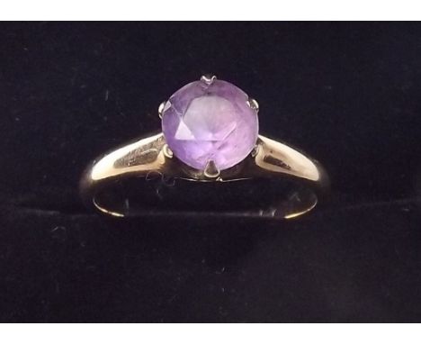 A yellow metal ring set amethyst, size L