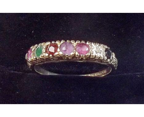 A 9 carat gold ring line set five various gem stones to spell 'Regards' size M