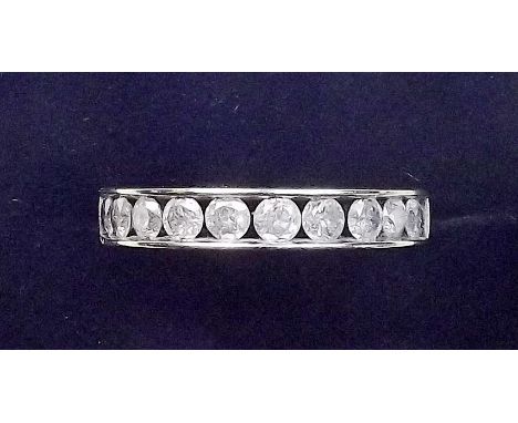 A 9 carat gold ring channel set diamonds, size O