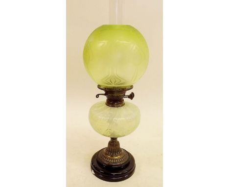 A Victorian oil lamp with Victorian green Art Nouveau etched glass shade and vaseline glass reservoir