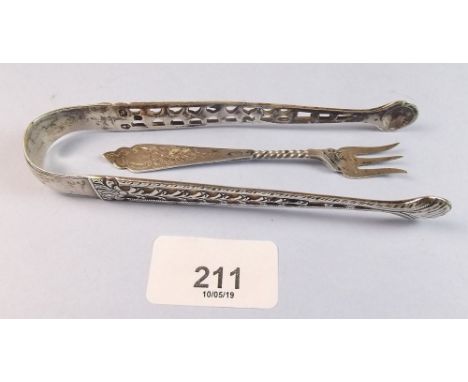A pair of George III silver sugar tongs - Birmingham 1775, and a silver pickle fork