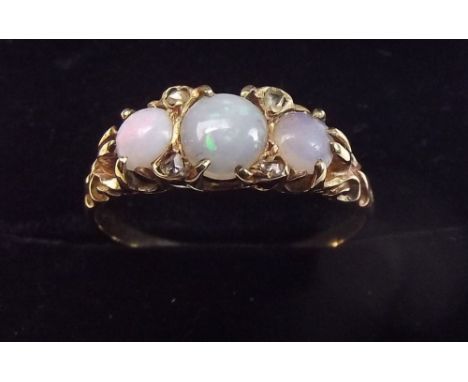 A Victorian gold three stone opal ring set chip diamonds, unmarked - size N