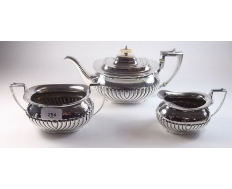 A silver three piece half gadrooned tea service by Daniel and Arter, Birmingham 1923 - 1320g