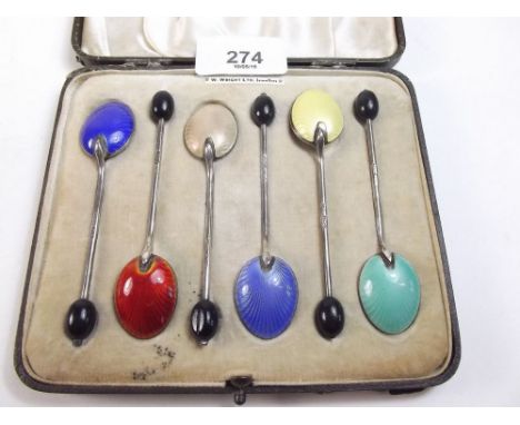 A set of six silver and enamel coffee spoons - boxed