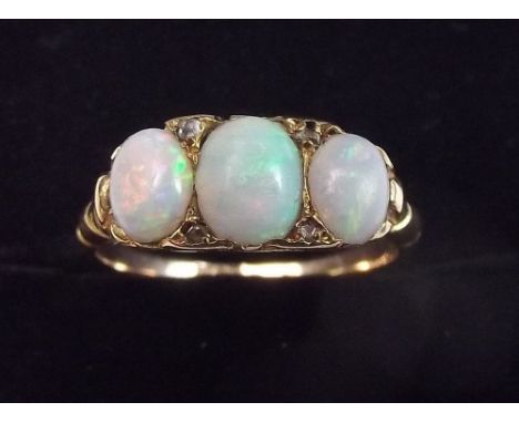 A Victorian 18 carat gold three stone opal ring set chip diamonds - size I 1/2