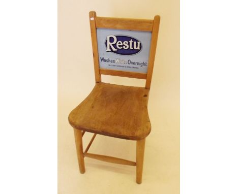 An early 20th century department store chair with enamel double advertising sign back for 'Restu' - 'Washes White Overnight'