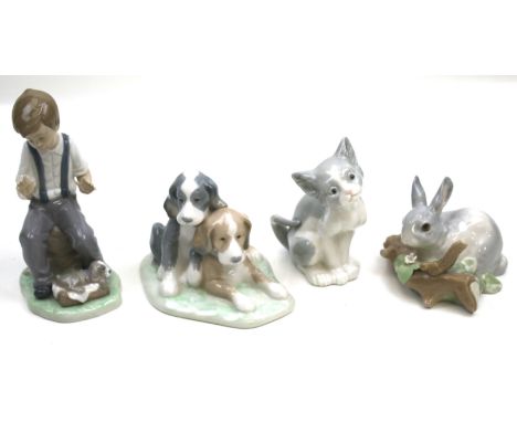 A collection of four Spanish porcelain figures. Including two Lladro cat and rabbit plus two Nao boy and two dogs. Max. H18cm