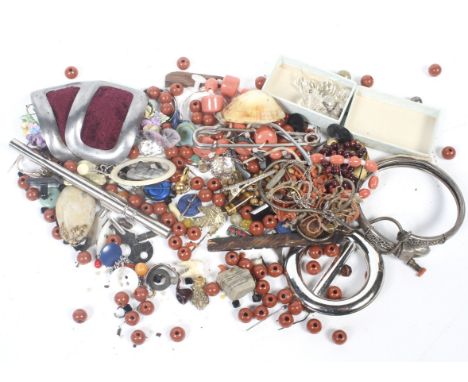 An ethnic white metal torque bangle, a paste 'wishbone' brooch and a collection of miscellaneous jewellery, beads and other i