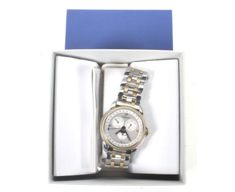 Tissot, a gentleman's stainless steel and gilt round bracelet watch, circa 1997, ref; C285/385C. The silvered dial with raise