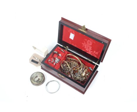 A collection of costume jewellery in a wooden box, including three shell cameos; two rolled-gold lockets, a paste five stone 