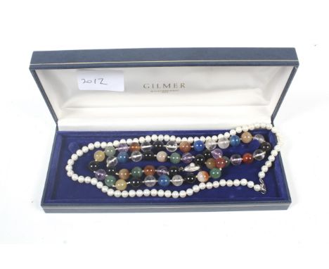 A cultured-pearl single row necklace, knotted on a trigger clasp stamped '925' and   an agate necklace.