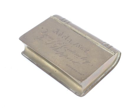 An 1862 brass novelty snuff box in the form of a small brass book. Inscription to lid 'Adela 1862 from Jn Coidinetey (?) Tom 