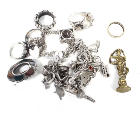 Seven silver and white metal dress rings and other items including a knot ring. A 'charm' bracelet; a Scottish hard stone ope