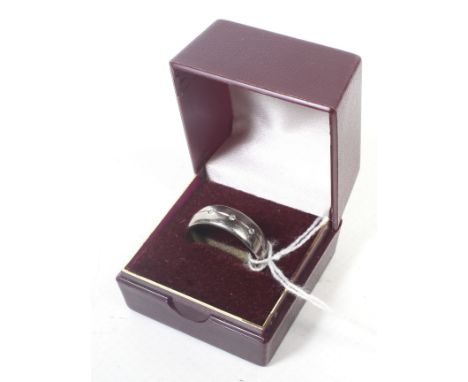 A gentleman's titanium and diamond wedding band, size P