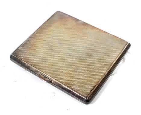 A silver rectangular engine turned cigarette case. With a vacant rectangular reserve, hallmarks for Birmingham 1930, 8.5cm x 