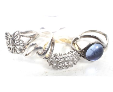A collection of five lady's silver and yellow metal rings including a signet ring
