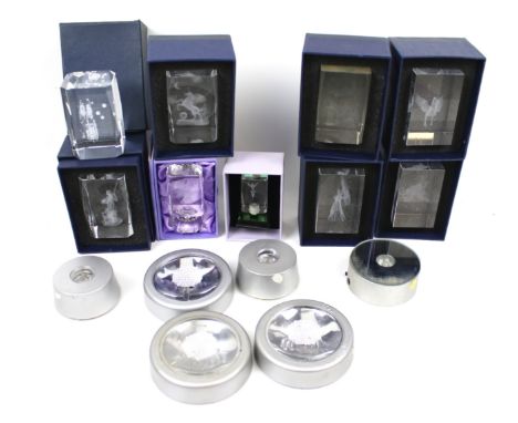A collection of light boxes illuminating crystal ornaments. Featuring scenes of angels, women, etc. The majority in the origi
