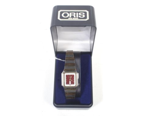 Oris, a lady's gold-plated and stainless steel rectangular automatic 21 jewels bracelet watch. With a red dial with gilt dot 