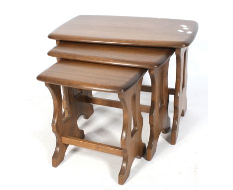 A mid-century Ercol nest of three tables. Stained wood with rounded corners. L57cm x D35cm x H42cm