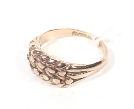 An early 20th century 9ct rose gold woven 'shot' ring. Hallmarks for Chester 1915, size O, 4.6g