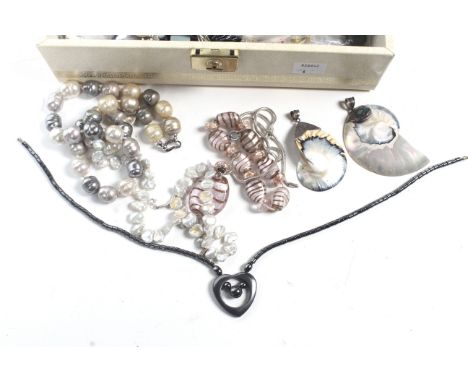 A collection of costume jewellery in a cream leatherette jewellery box. Including; A large cultured-freshwater-pearl barrel b