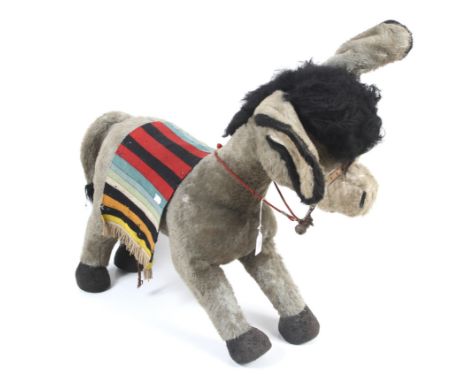 A large vintage Merrythought donkey. Straw filled, complete with bells and blanket.  H72cm x L83cm