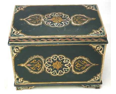 A vintage wooden trunk. Painted green with scrolling details, on bracket feet, H49cm x W65.5cm x D46cm