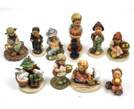 A collection of ten assorted Goebel figurines. Including 'Snuggle Up' BH 67 1998, etc. Max H13cm