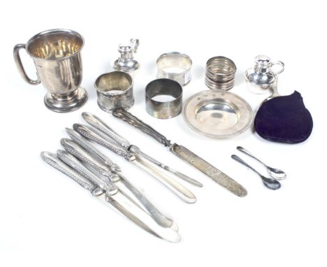 A small collection of silver and plated items. To include a silver christening mug with a loop handle and a broad slightly-do