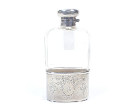 An early 20th century silver mounted facetted clear-glass spirit or hip flask, The hinged cover and removable cup each engrav