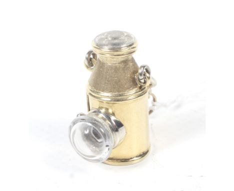 A Continental lantern shaped pendant/charm. With a swing handle, satinised top, cover and hinged door, and a 'glass' lens, th
