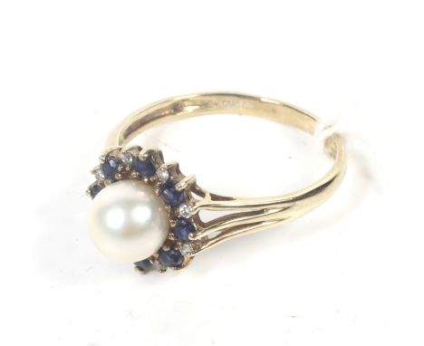 A modern QVC 9ct gold, cultured-pearl, sapphire and diamond cluster ring. The 6.5mm diameter cultured-pearl within an alterna