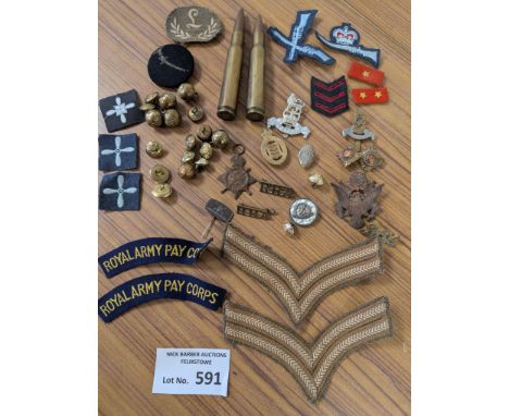 Collectables: Tin of militaria including various patches, badges, medals, etc.