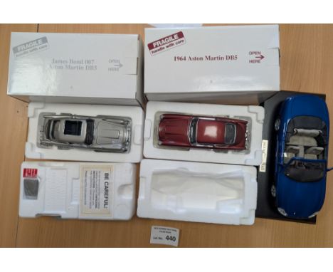 Diecast: Danbury Mint and Tag Heuer boxed car models, including Aston Martin DB5 1964, James Bond Aston Martin DB5, and Jagua
