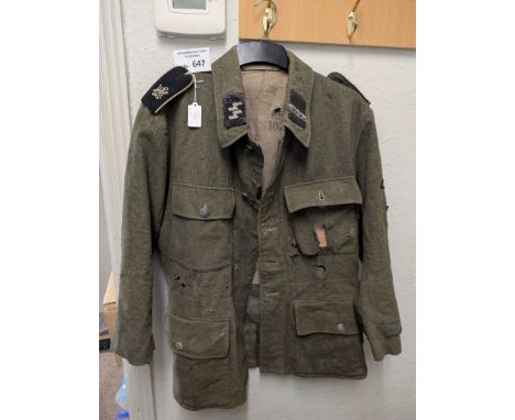 Collectables; Militaria: German militaria, an SS badged tunic, well worn, most badges intact. 
