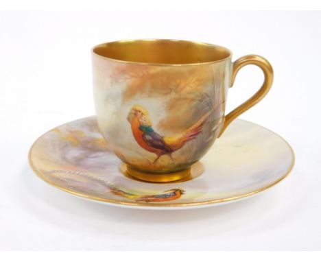 A Royal Worcester porcelain coffee cup and saucer, painted with Chinese pheasants, by James Stinton, c1915/16, printed marks.