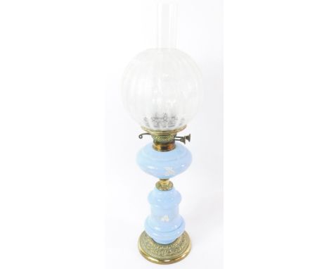 A Victorian turquoise glass and brass oil lamp, with enamel floral decoration, etched globular glass shade, 66cm high.