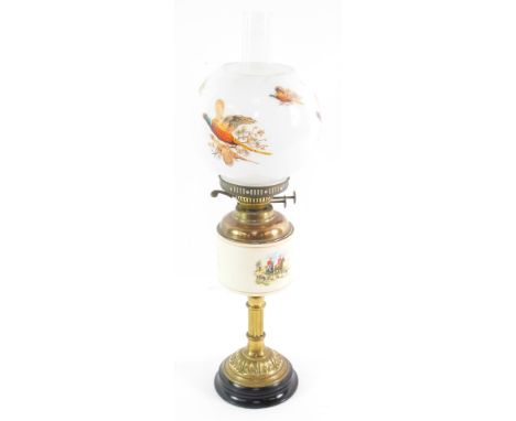 A Duplex brass and ceramic oil lamp, printed with hunting scenes, with a milk glass shade printed with pheasants in flight, 6