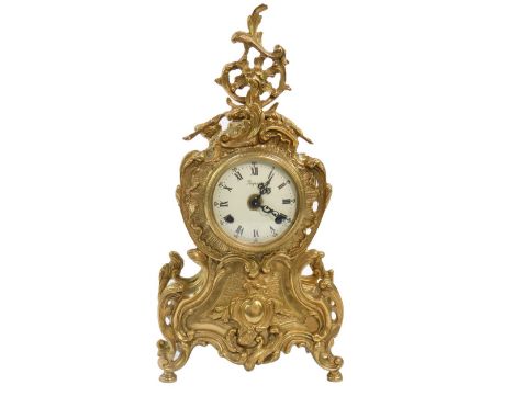 An Italian brass cased rococo style mantel clock, enamel dial, signed Imperial, bearing Roman and Arabic numerals, eight day 