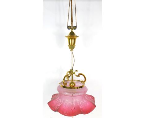 An Edwardian brass hanging wall light, with an Art Nouveau floral cranberry glass octagonal shade, shade 39cm dia.