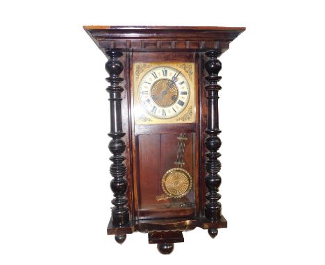 A late 19thC ebonised and oak cased wall clock, probably American, square brass dial with circular enamel chapter ring, beari