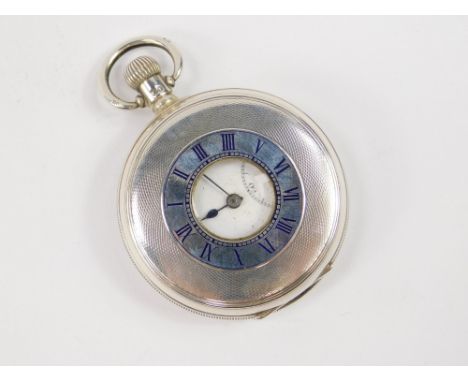 A George V gentleman's silver half hunter pocket watch, outer dial with Roman numerals in blue enamel, internal dial bearing 