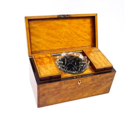 A Georgian satinwood and rosewood cross banded tea caddy, lid opening to reveal two cannister flanking a mixing bowl recess w