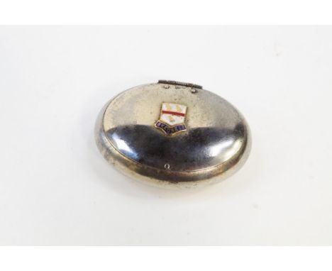 An oval snuff tin, with an enamel armorial for Skegness, white metal, 8.5cm long.