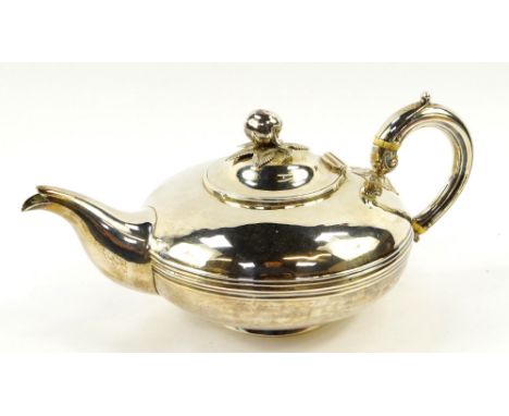 A William IV silver teapot, of compressed Roman lamp form, the hinged lid with an apple finial, J & S Savory, London 1836, 18