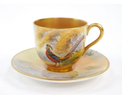 A Royal Worcester porcelain coffee cup and saucer, painted with a Chinese Pheasant, possibly by James Stinton, together with 